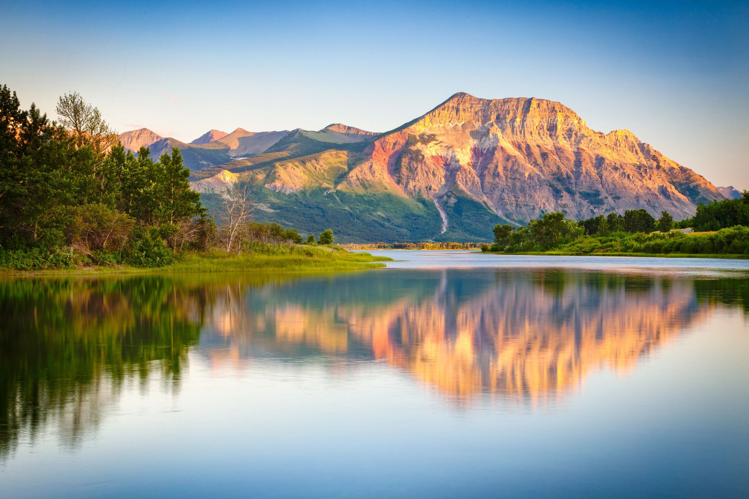 Mountain lake reflection golden hour